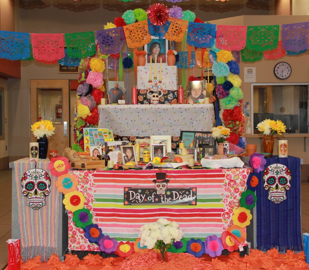 A dazzling display of colors used to decorate an ofrenda paying homage to staff members of Las Cruces Public Schools who have passed away over the course of the year.
